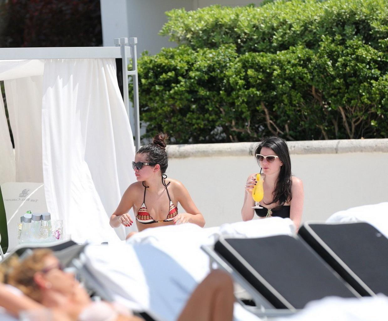 16P Selena Gomez showing off her bikini body poolside in Miami