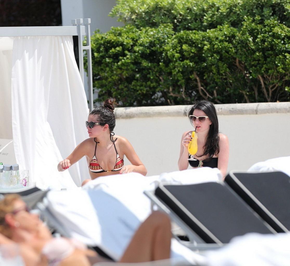 16P Selena Gomez showing off her bikini body poolside in Miami