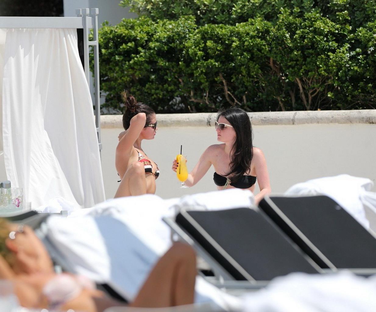 16P Selena Gomez showing off her bikini body poolside in Miami