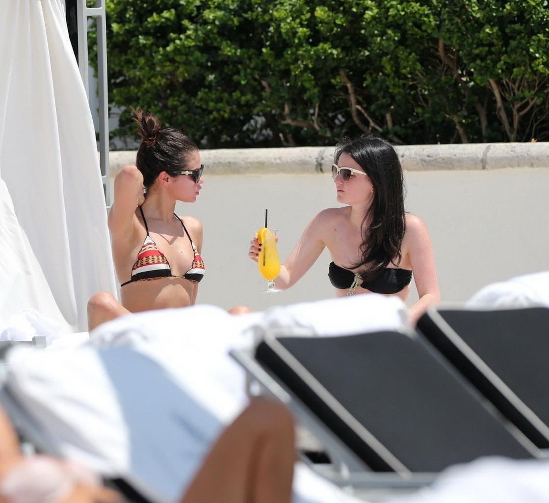 16P Selena Gomez showing off her bikini body poolside in Miami