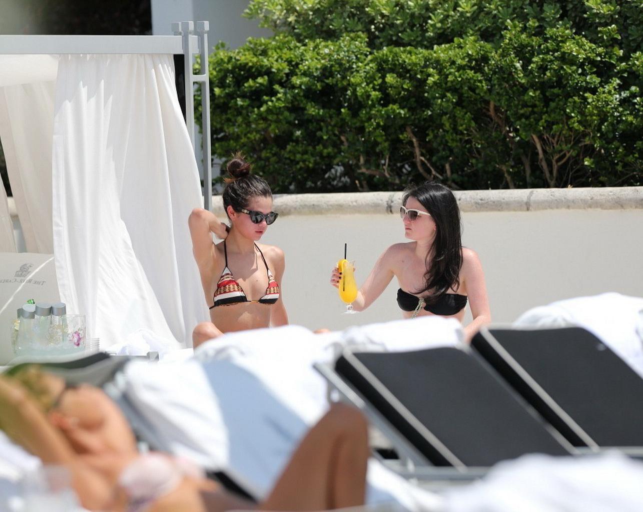 16P Selena Gomez showing off her bikini body poolside in Miami