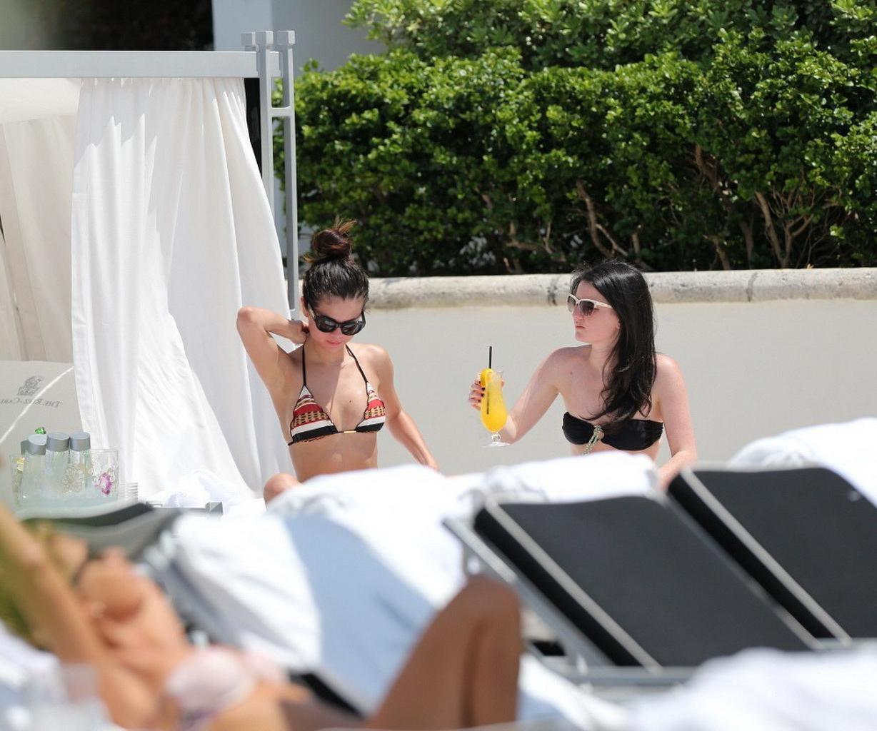 16P Selena Gomez showing off her bikini body poolside in Miami