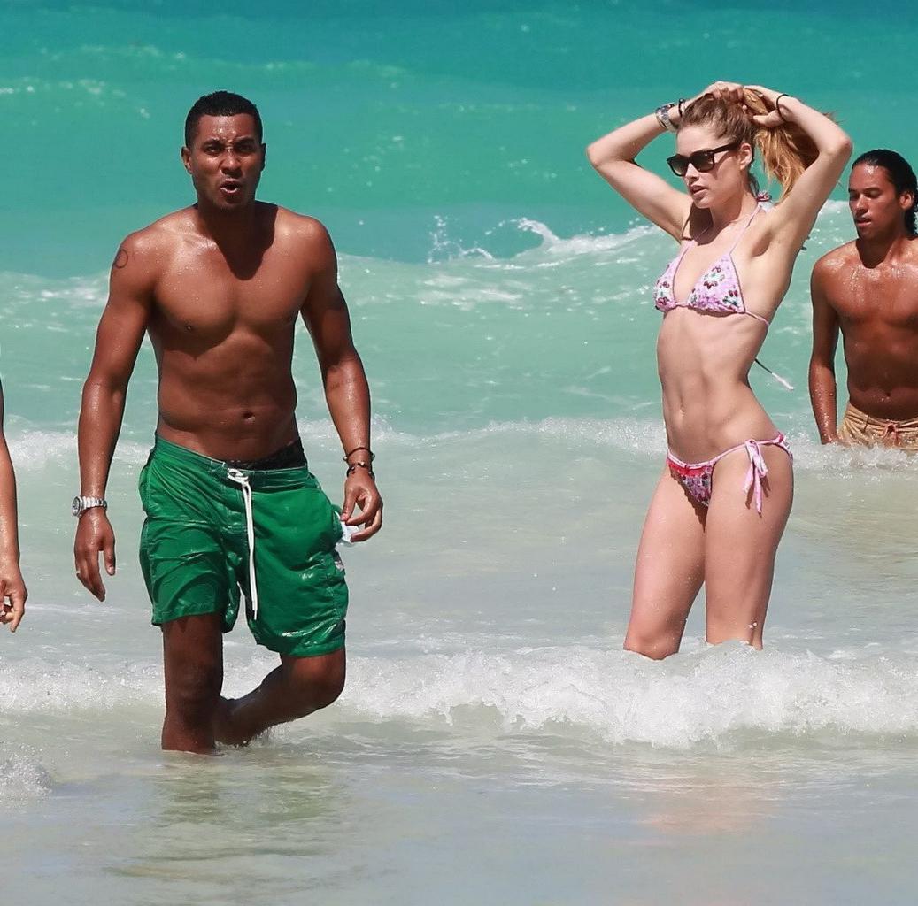 16P Doutzen Kroes wearing tiny pink bikini on the beach in Miami