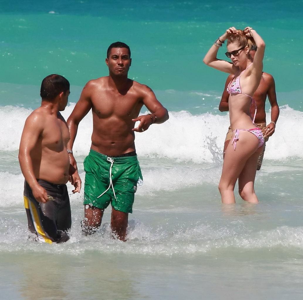 16P Doutzen Kroes wearing tiny pink bikini on the beach in Miami