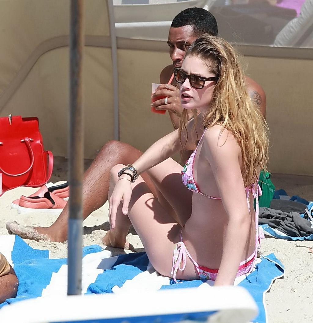 16P Doutzen Kroes wearing tiny pink bikini on the beach in Miami