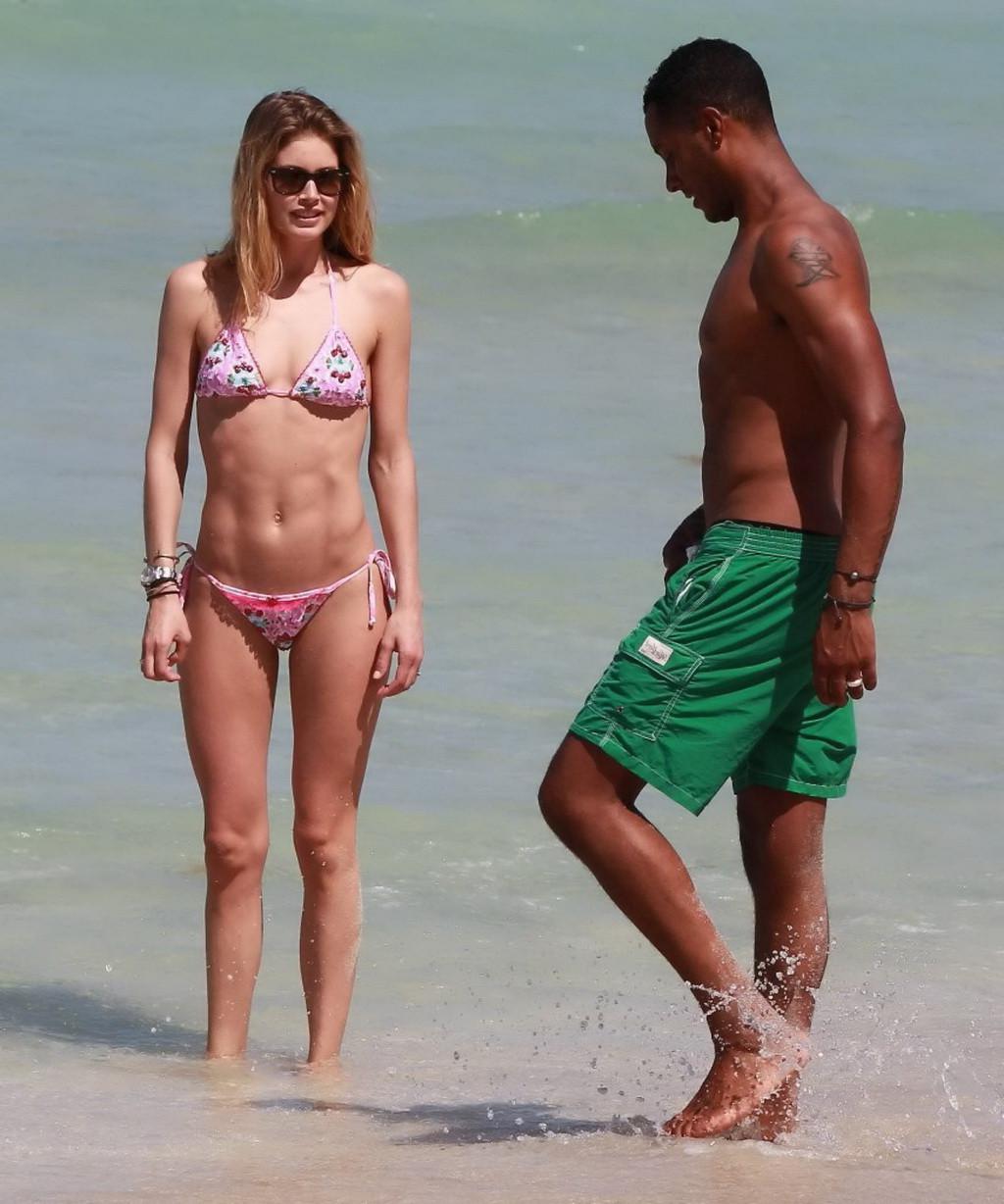 16P Doutzen Kroes wearing tiny pink bikini on the beach in Miami