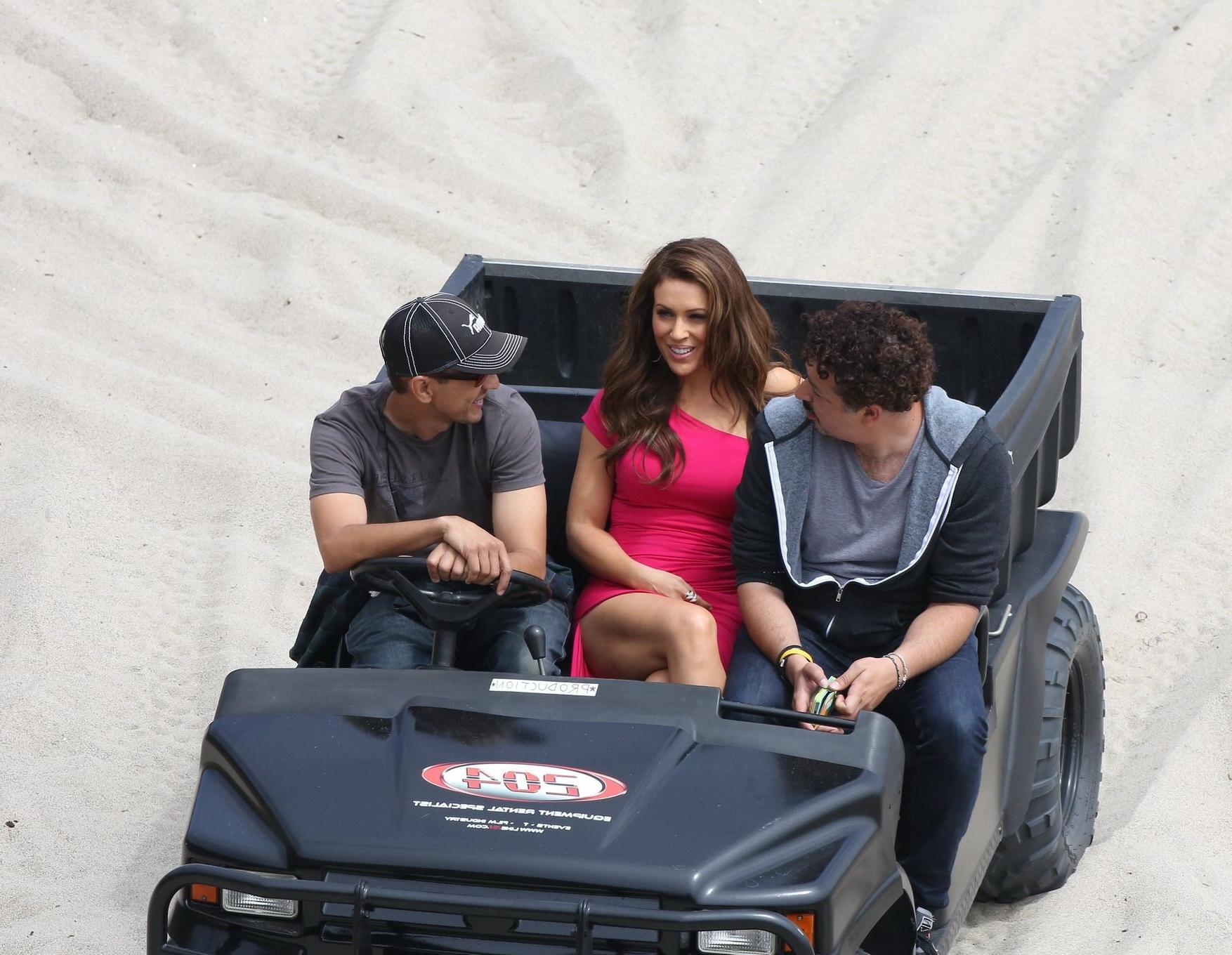 16P Alyssa Milano upskirt wearing short tight pink dress on the film set at the beac