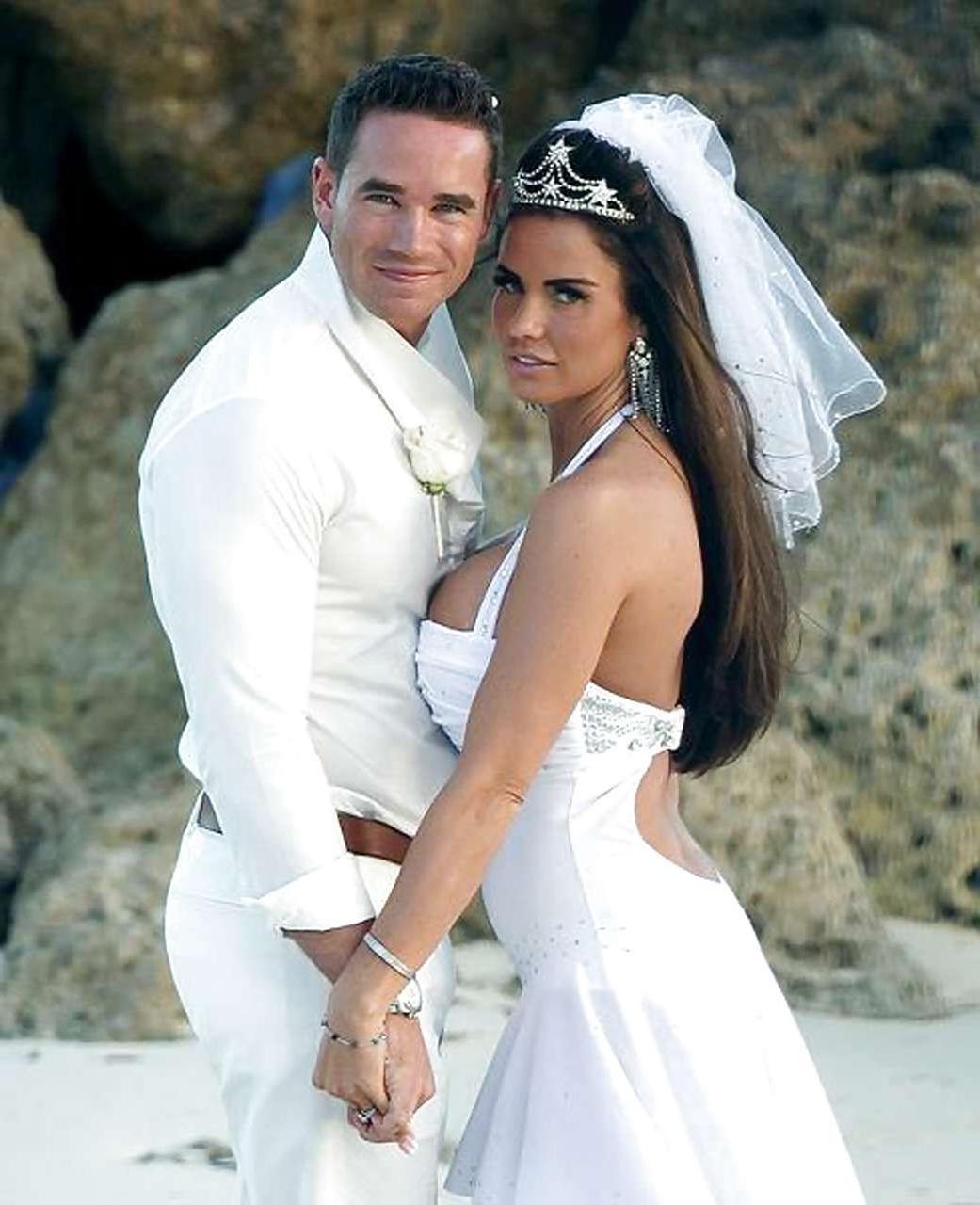 9P Katie Price sunbathing topless on beach and spreading her legs wide