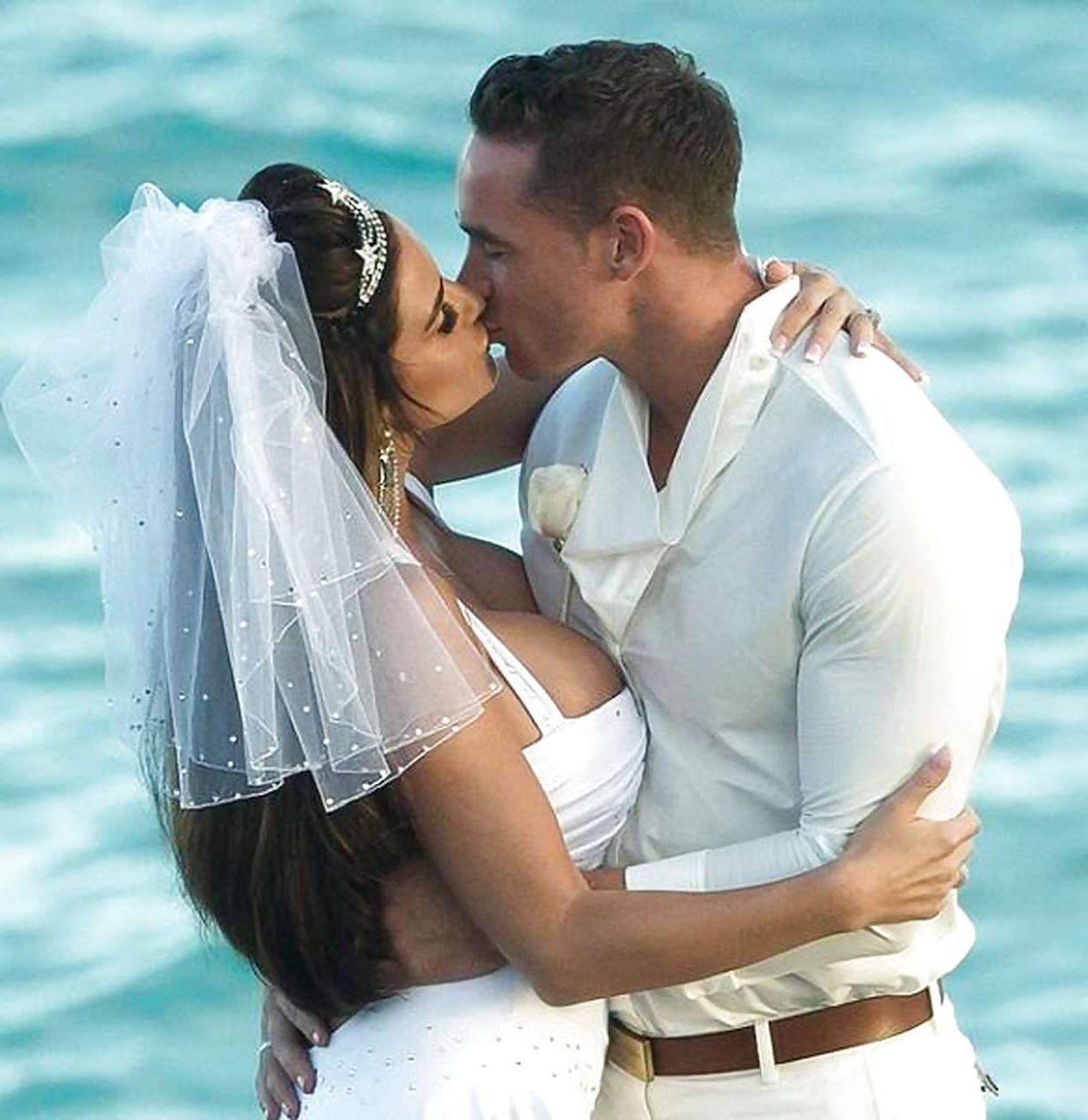 9P Katie Price sunbathing topless on beach and spreading her legs wide
