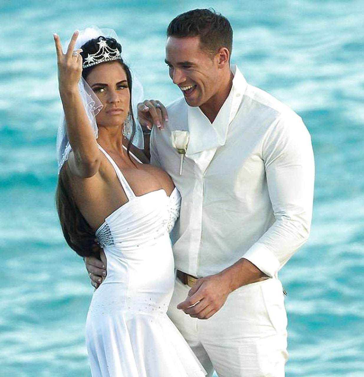 9P Katie Price sunbathing topless on beach and spreading her legs wide