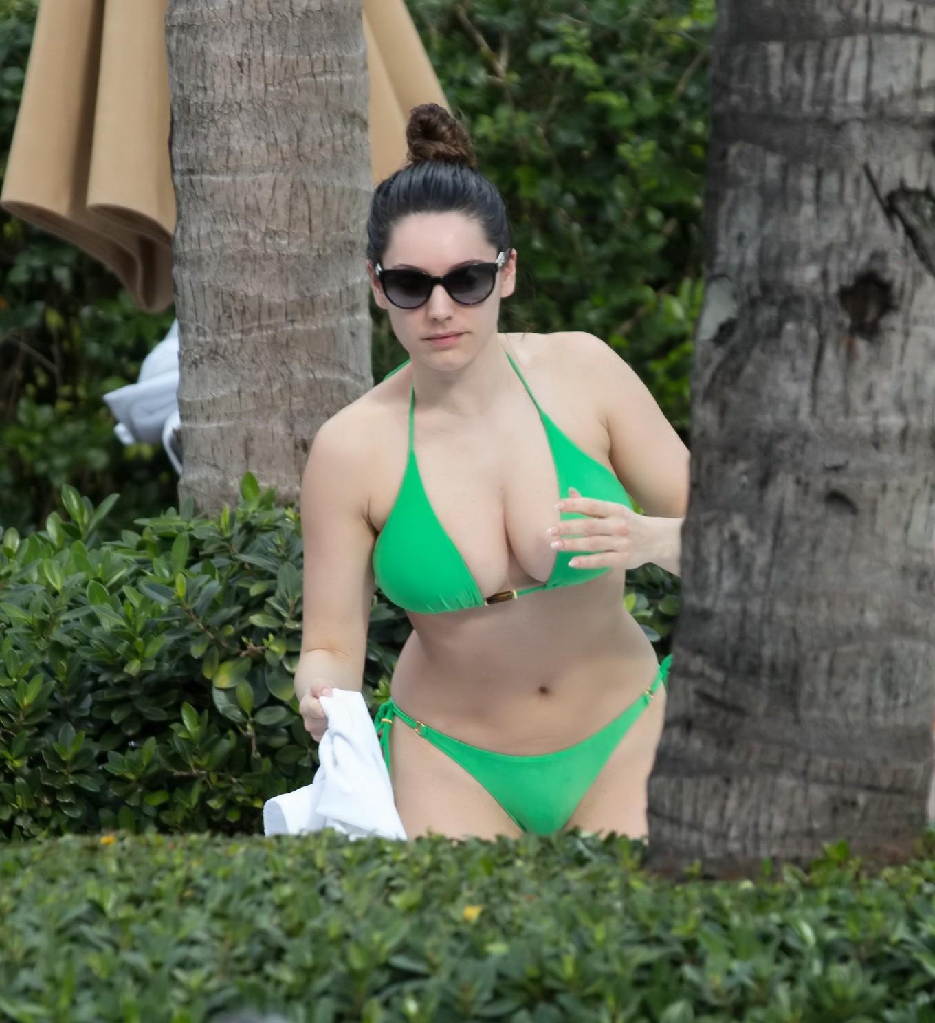 10P Kelly Brook shows off her curvy body wearing skimpy green bikini poolside in Mia