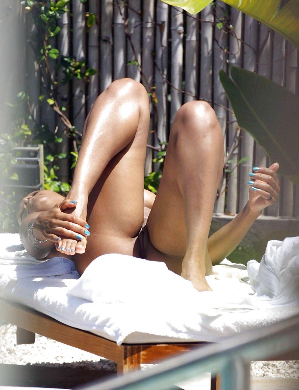 10P Janet Jackson exposing her bare pussy and tits while sunbathing nude