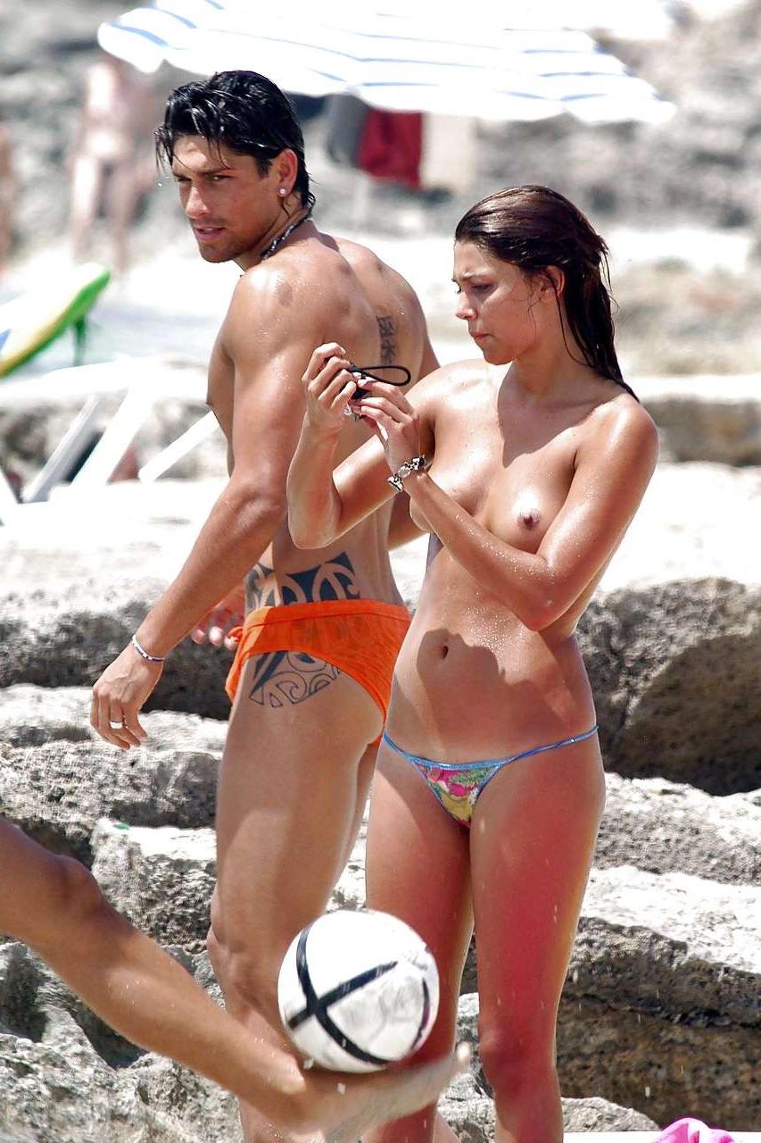 10P Belen Rodriguez exposing her boobs and ass in thong on beach