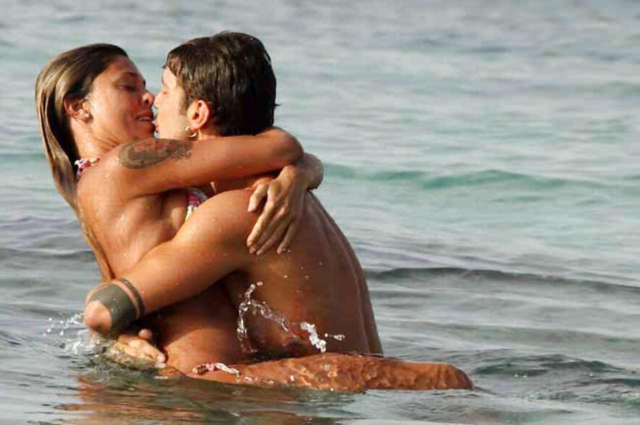 10P Belen Rodriguez exposing her boobs and ass in thong on beach