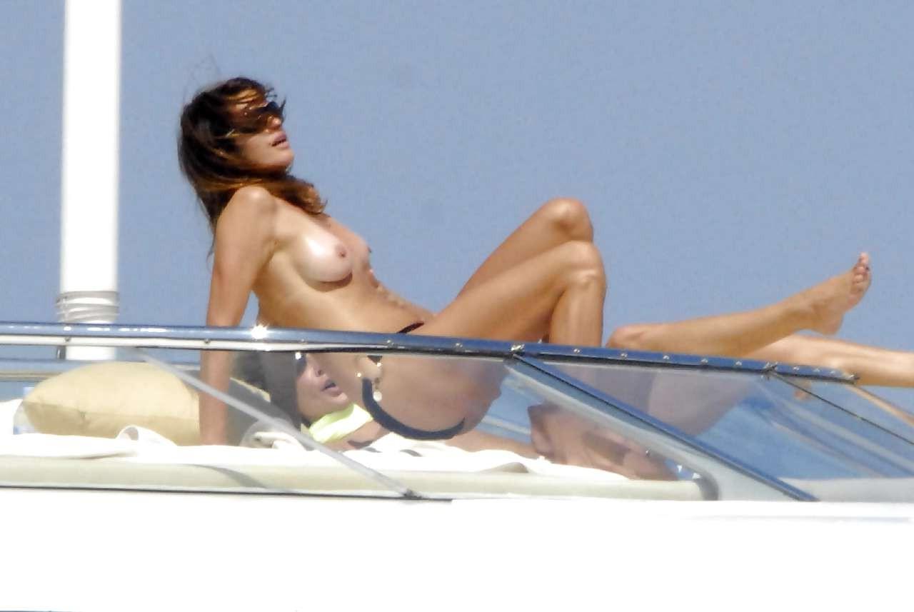 10P Cindy Crawford exposing her nice big tits on yach and in leather skirt
