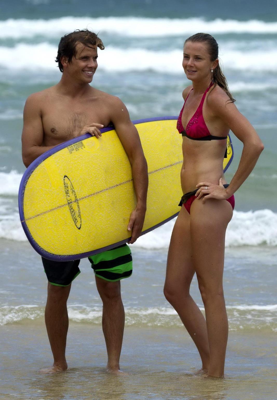 10P Daniela Hantuchova in bikini surfing on a beach in Brisbane, Australia