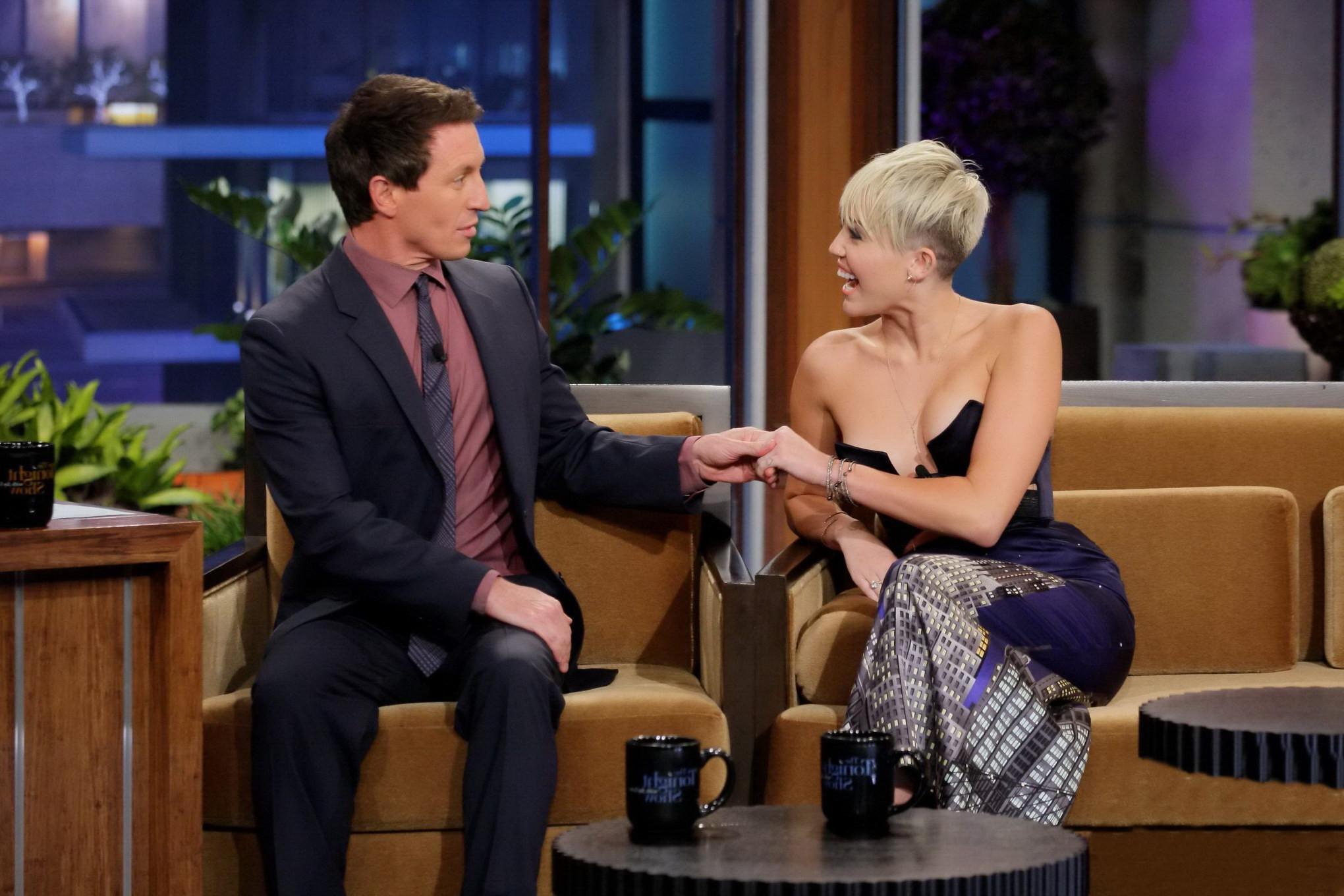 10P Miley Cyrus braless wears very revealing dress on The Tonight Show with Jay Leno