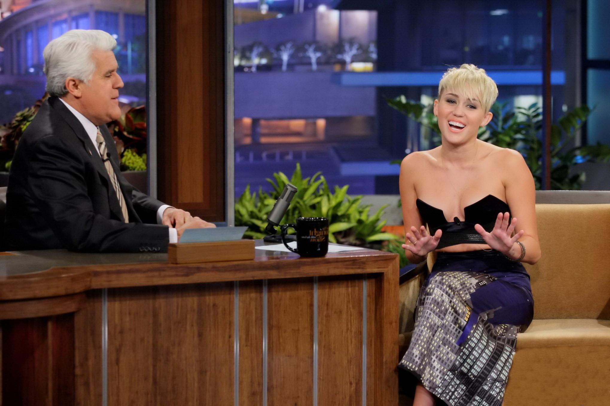 10P Miley Cyrus braless wears very revealing dress on The Tonight Show with Jay Leno