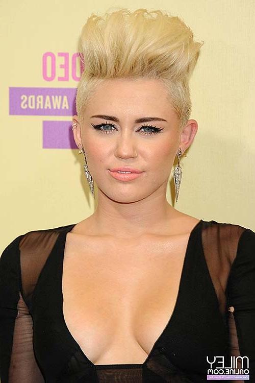 10P Miley Cyrus looking very sexy and huge cleavage photos