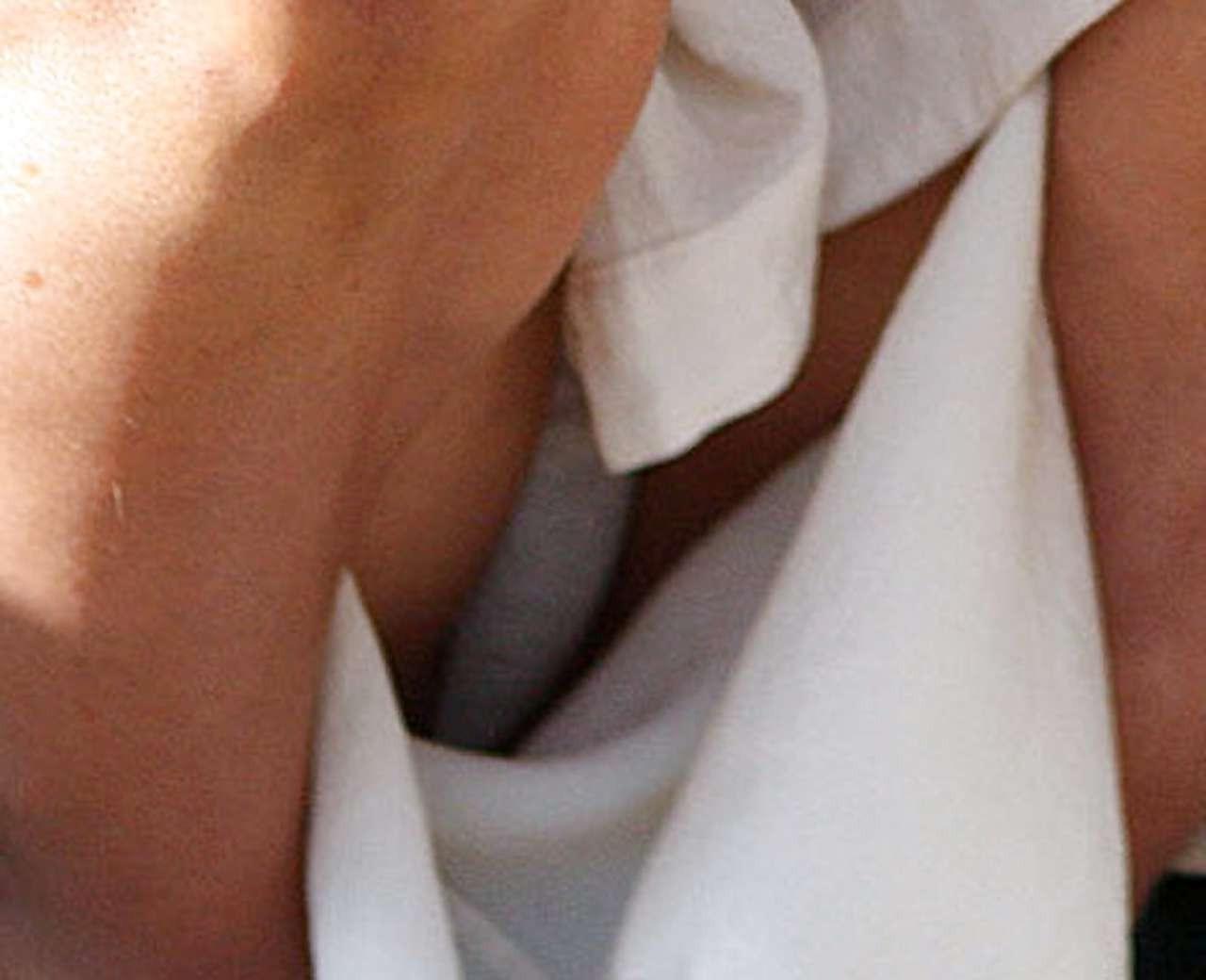 10P Sophie Monk exposing her huge boobs while sunbathing topless on beach