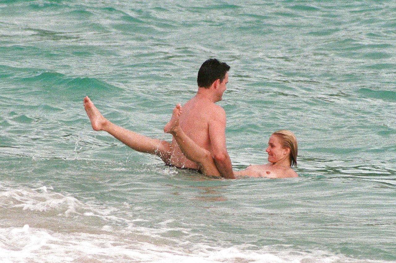 10P Cameron Diaz exposing her nice small boobs while enjoy with boyfriend on beach