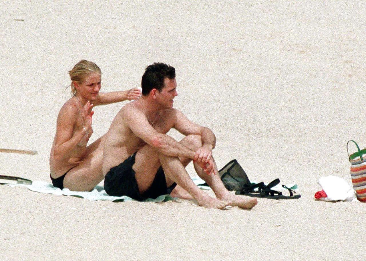 10P Cameron Diaz exposing her nice small boobs while enjoy with boyfriend on beach