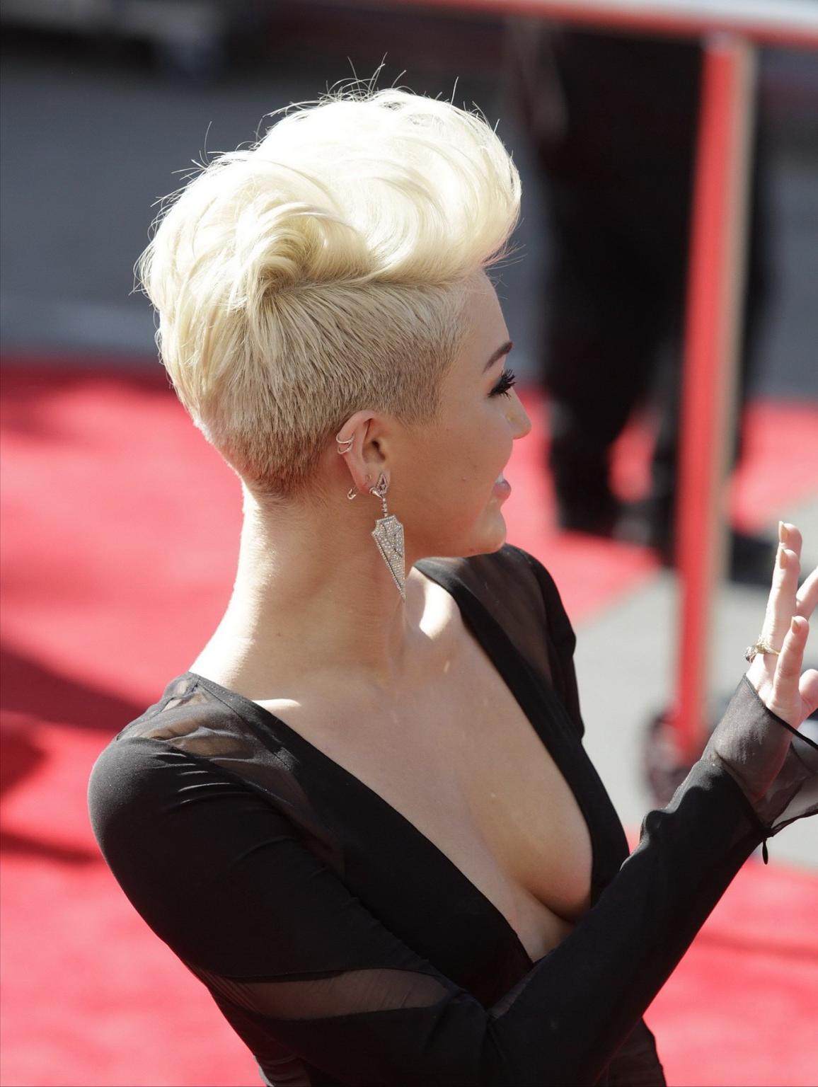10P Miley Cyrus flashing her big assets braless in black see through dress at MTV Vi