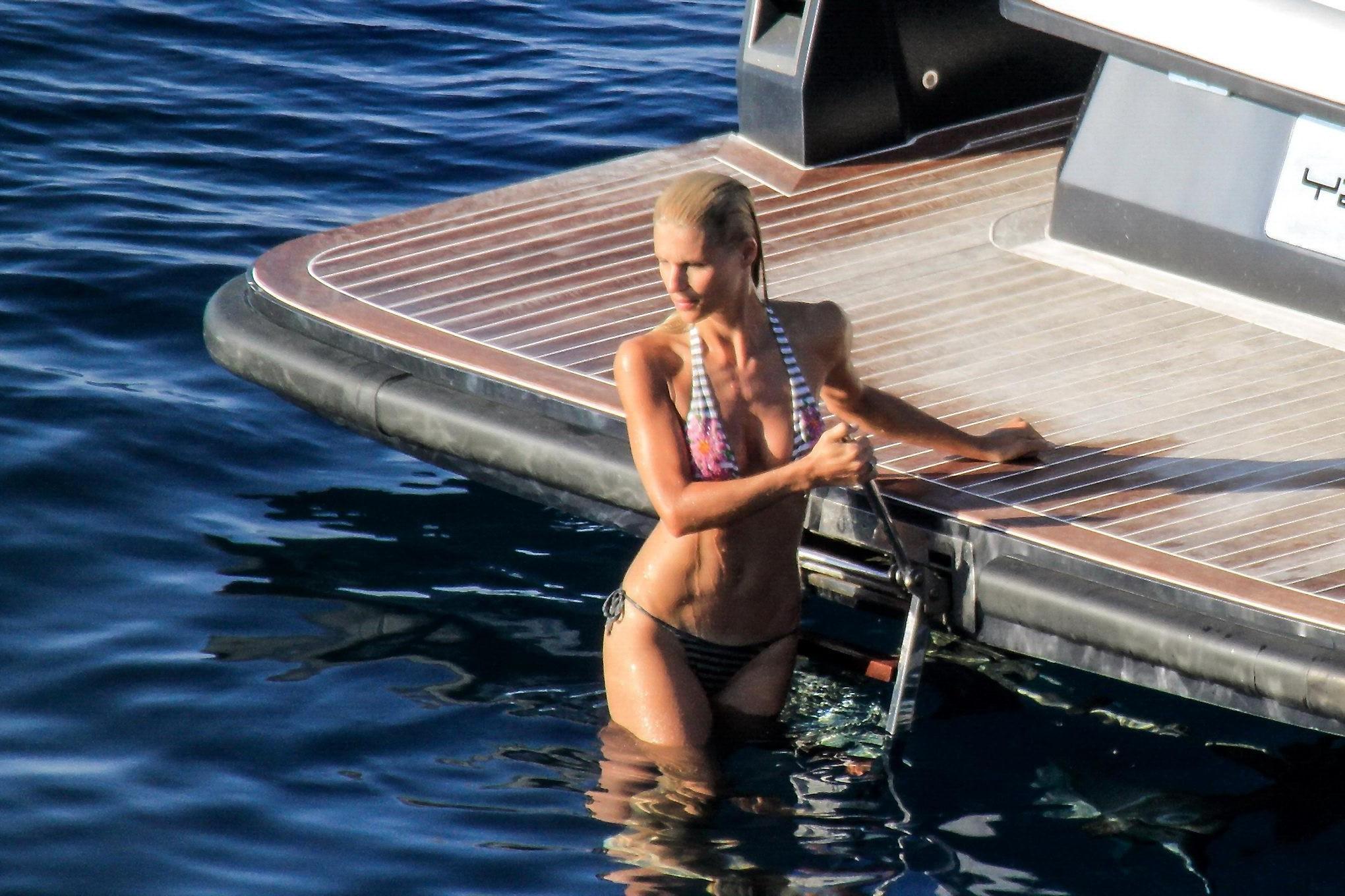 10P Michelle Hunziker wearing a thong bikini on a yacht in Elba