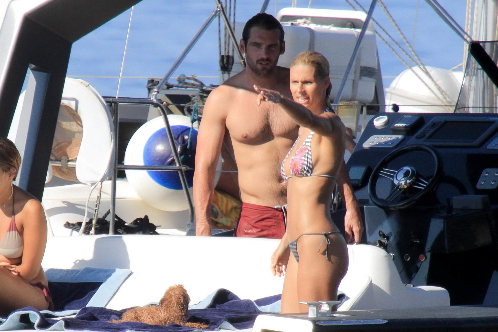 10P Michelle Hunziker wearing a thong bikini on a yacht in Elba