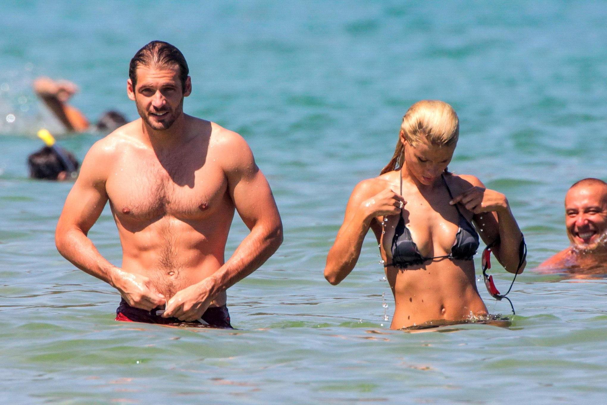 10P Michelle Hunziker in night camo bikini making out with her boyfriend on a beach 