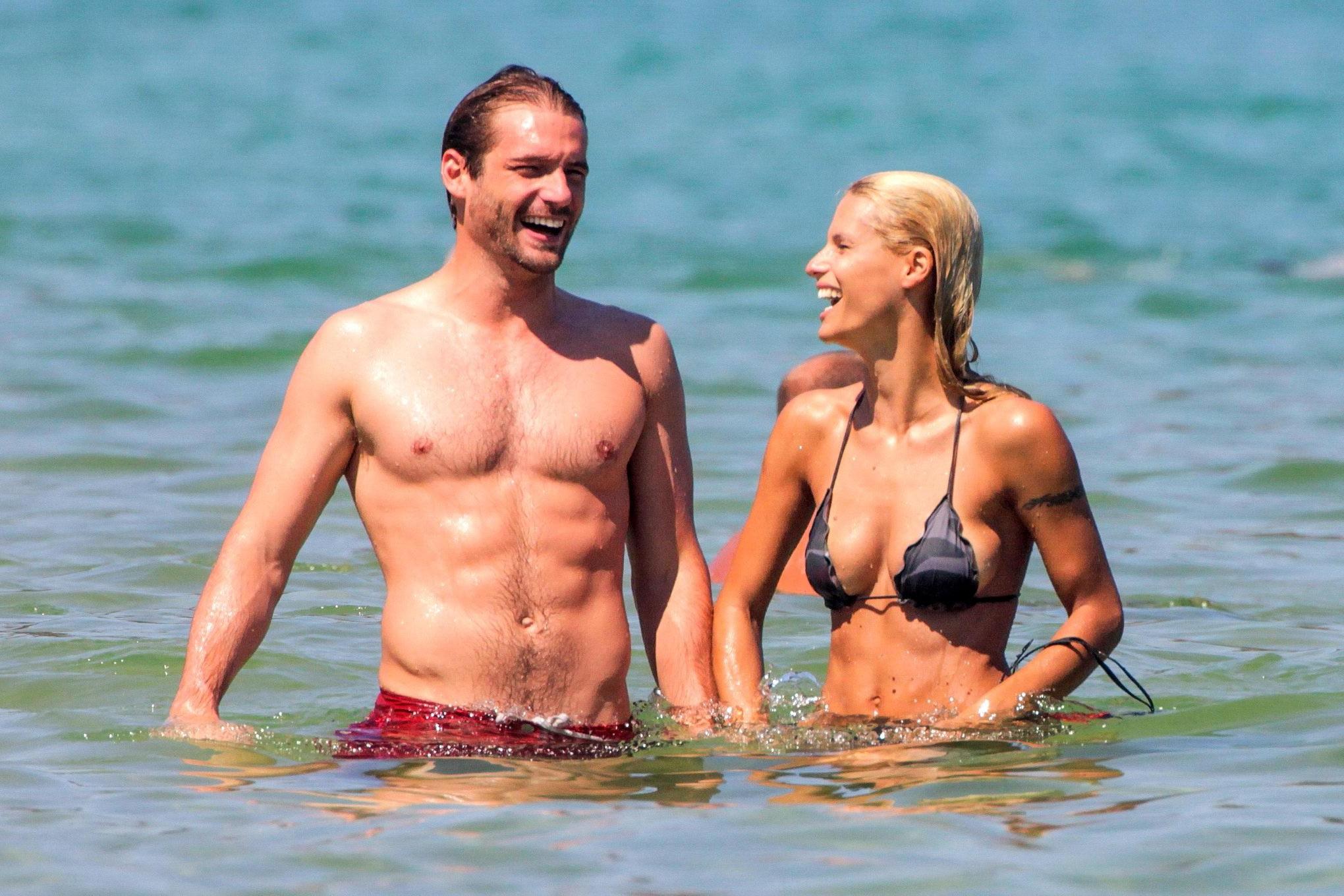 10P Michelle Hunziker in night camo bikini making out with her boyfriend on a beach 
