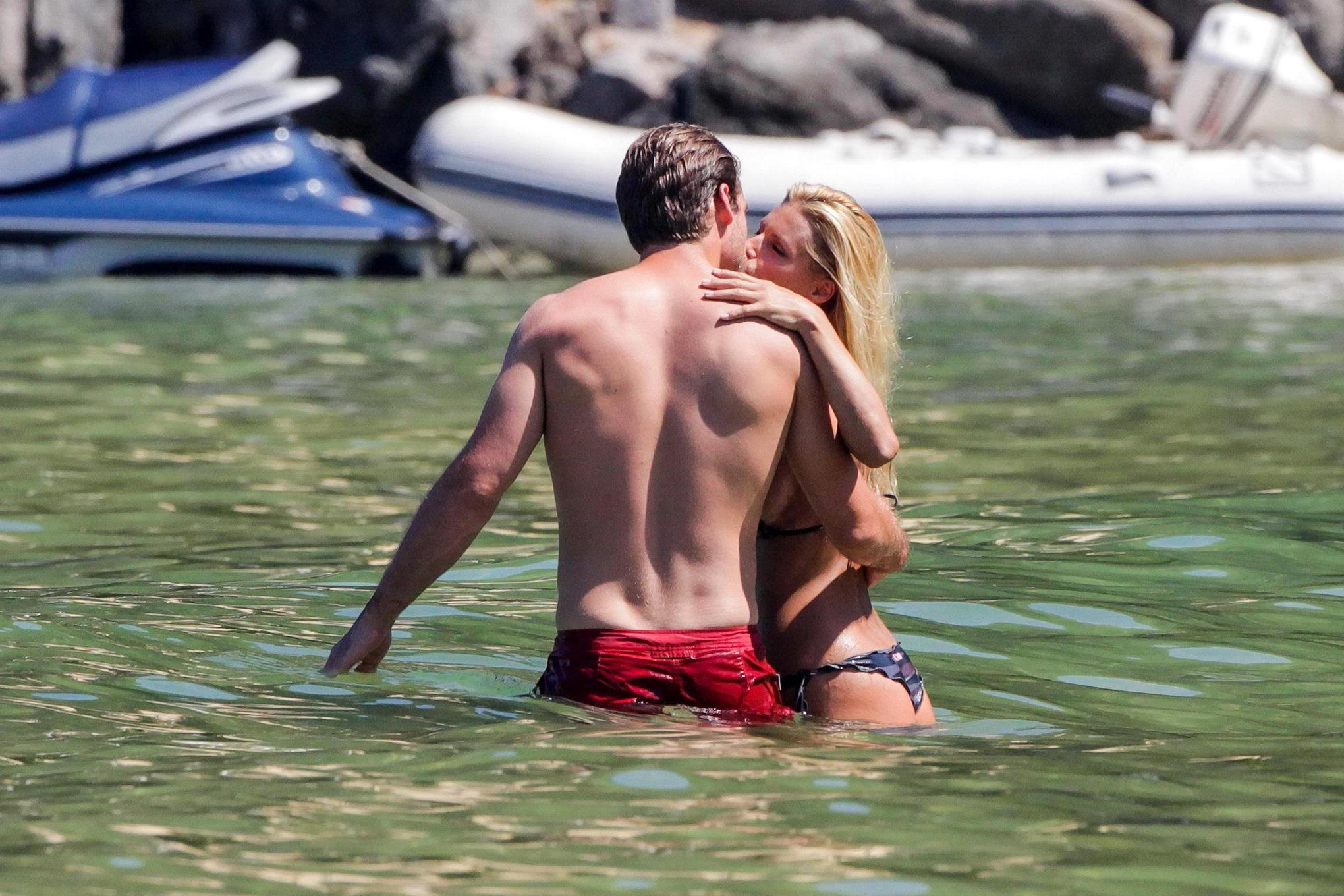 10P Michelle Hunziker in night camo bikini making out with her boyfriend on a beach 