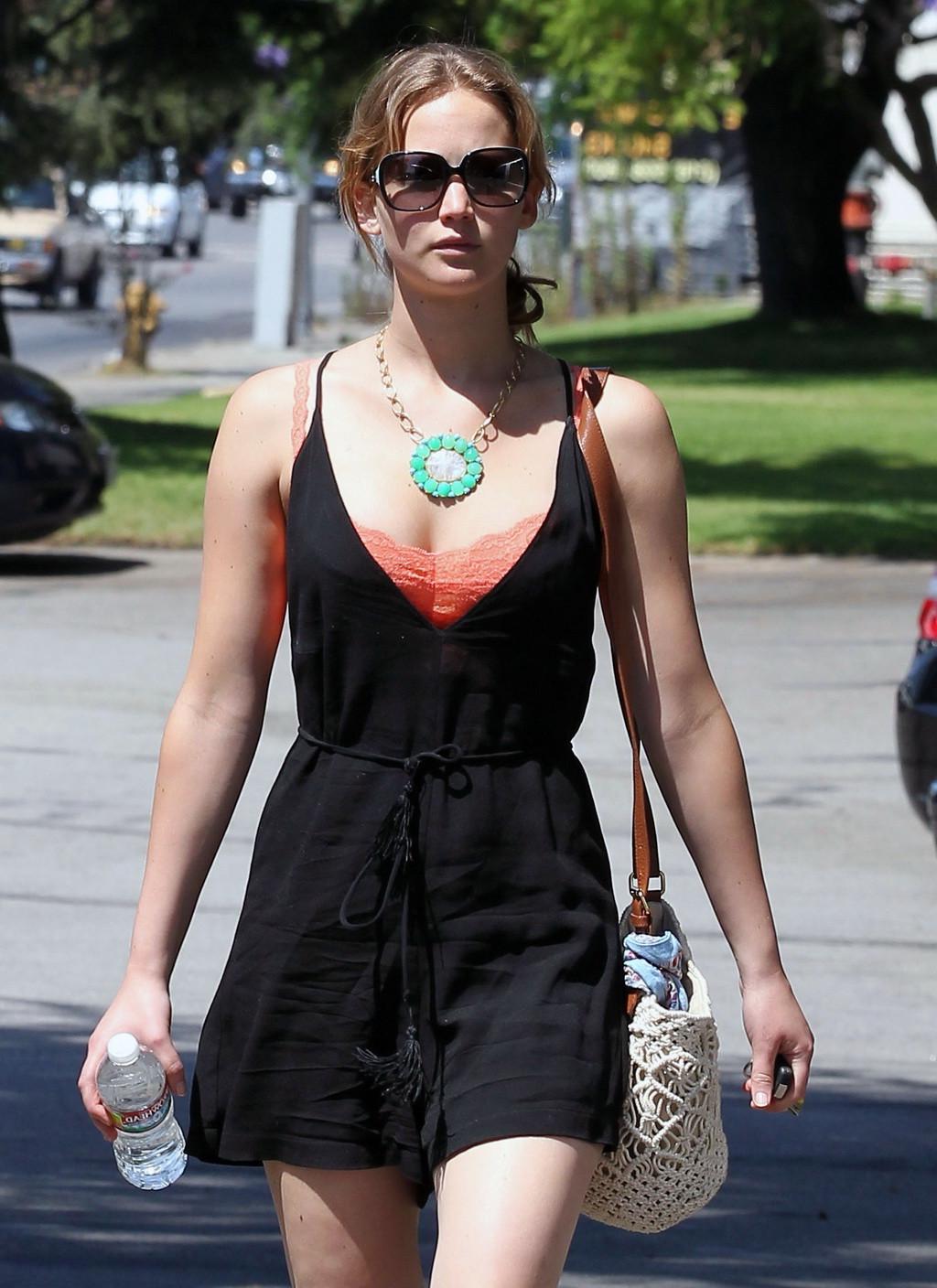 9P Jennifer Lawrence leggy and showing big cleavage in black low cut mini dress whi