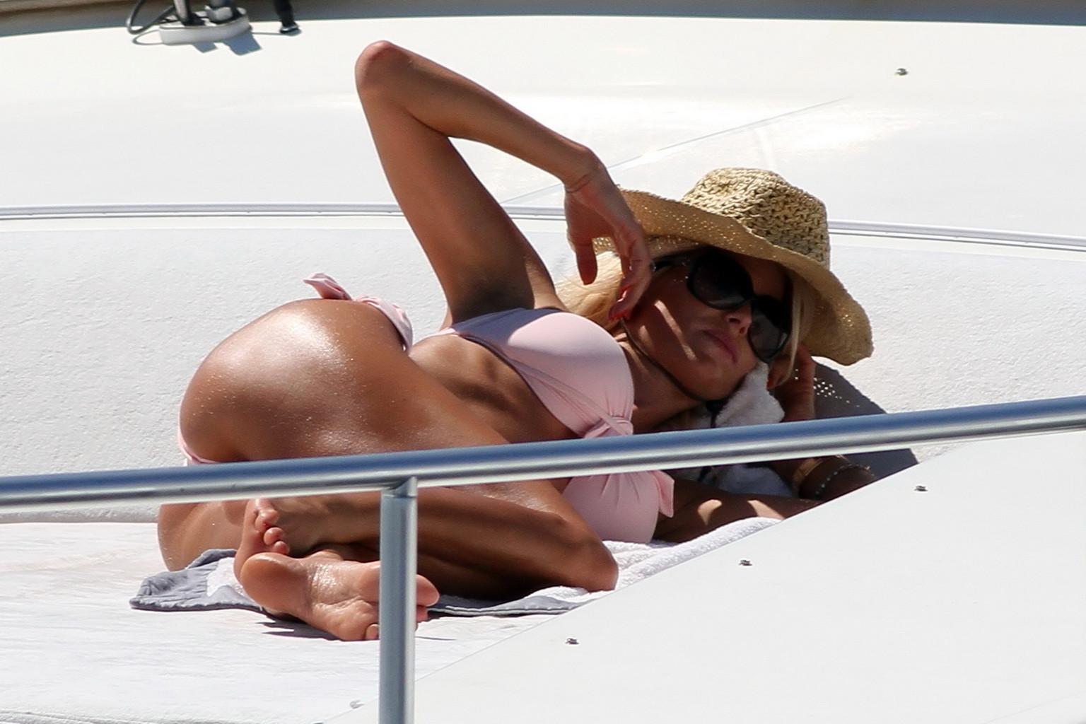 10P Victoria Silvstedt showing her toned ass in thong flesh colored bikini at the ya