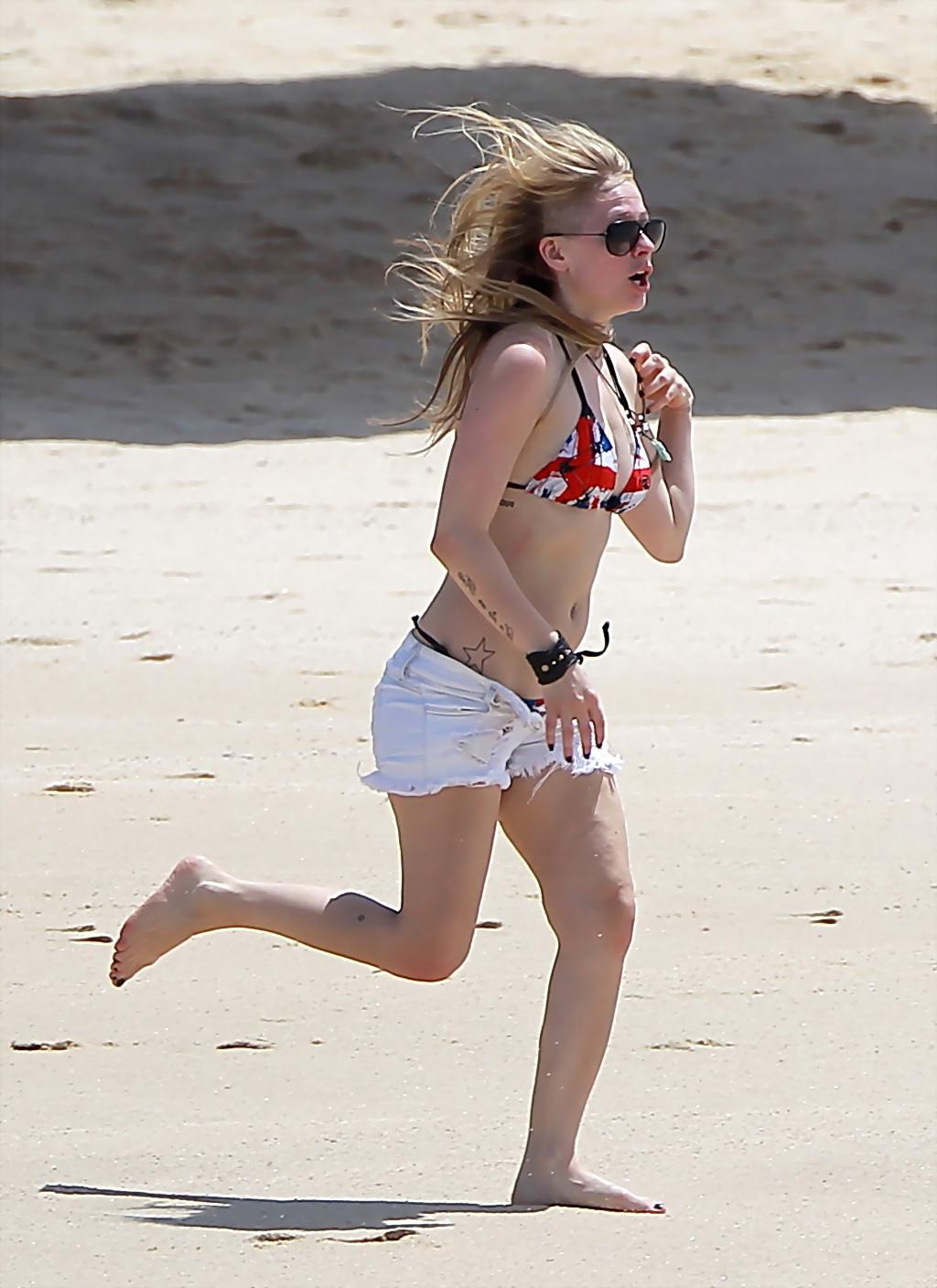 9P Avril Lavigne in bikini top groping with her busty friend at the beach in Los Ca
