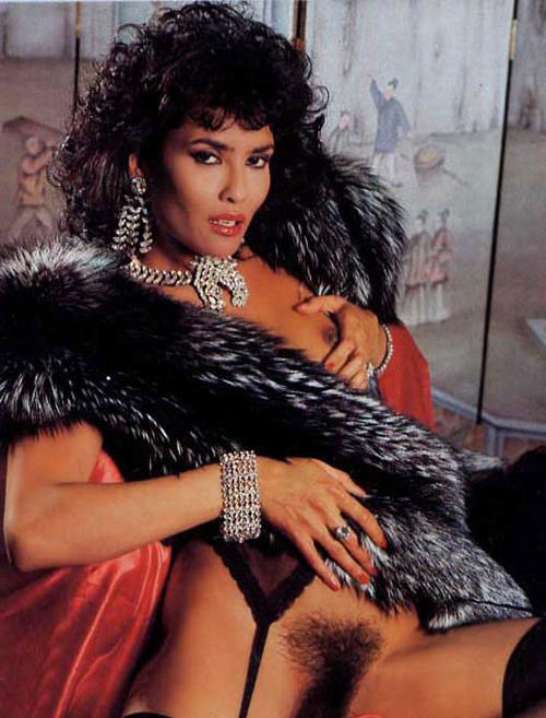 16P Laura Gemser body shows her tits and ass