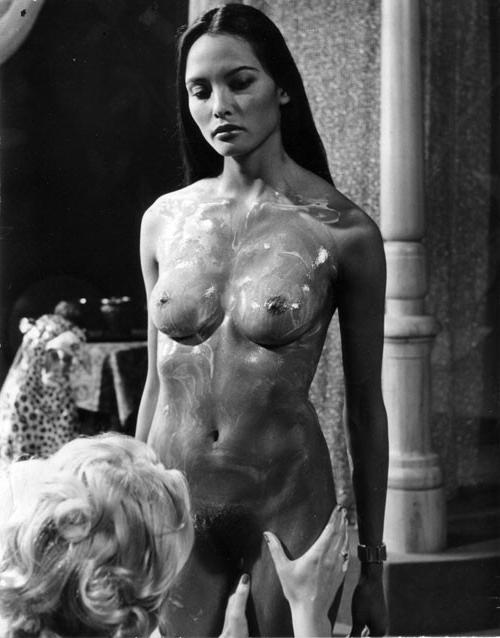 16P Laura Gemser body shows her tits and ass