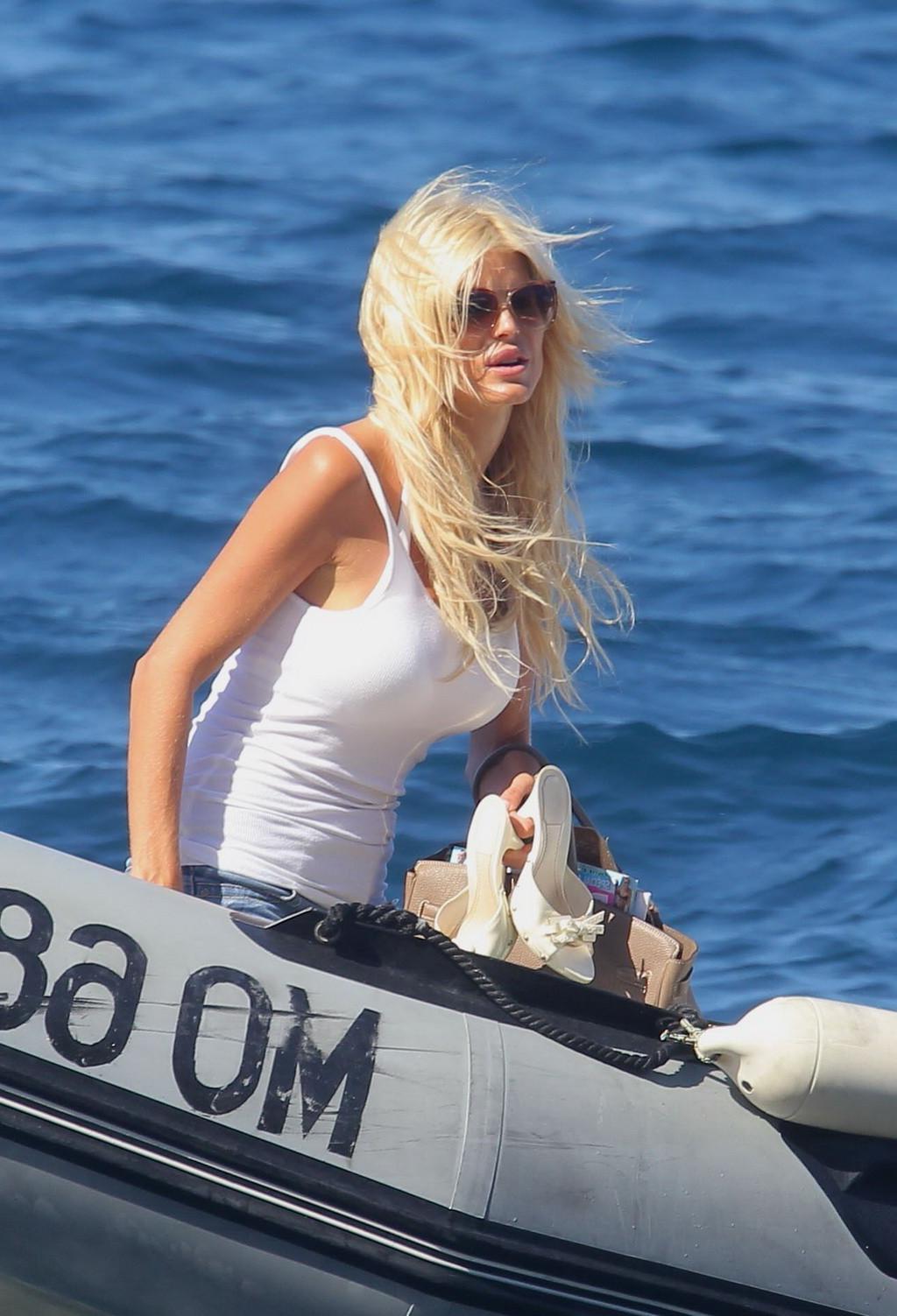 10P Victoria Silvstedt flashing her shaved pussy while sunbathing in bikini on yacht