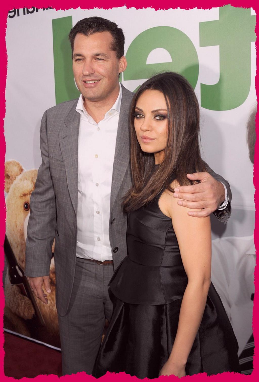10P Mila Kunis showing big cleavage braless in a black mini dress at the premiere of