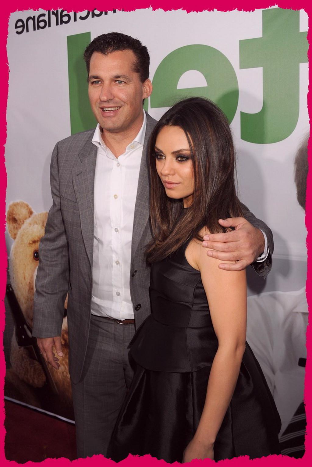 10P Mila Kunis showing big cleavage braless in a black mini dress at the premiere of