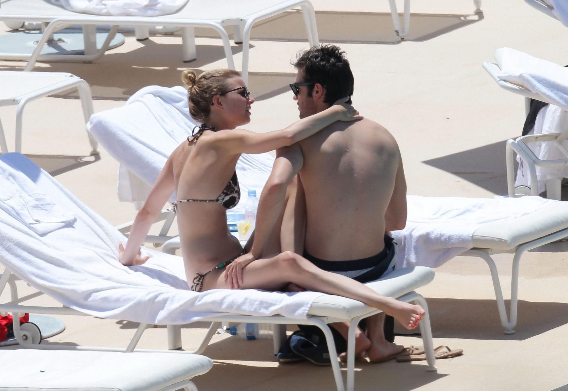 10P Emily VanCamp in snake print bikini petting with her boyfriend poolside in Monac