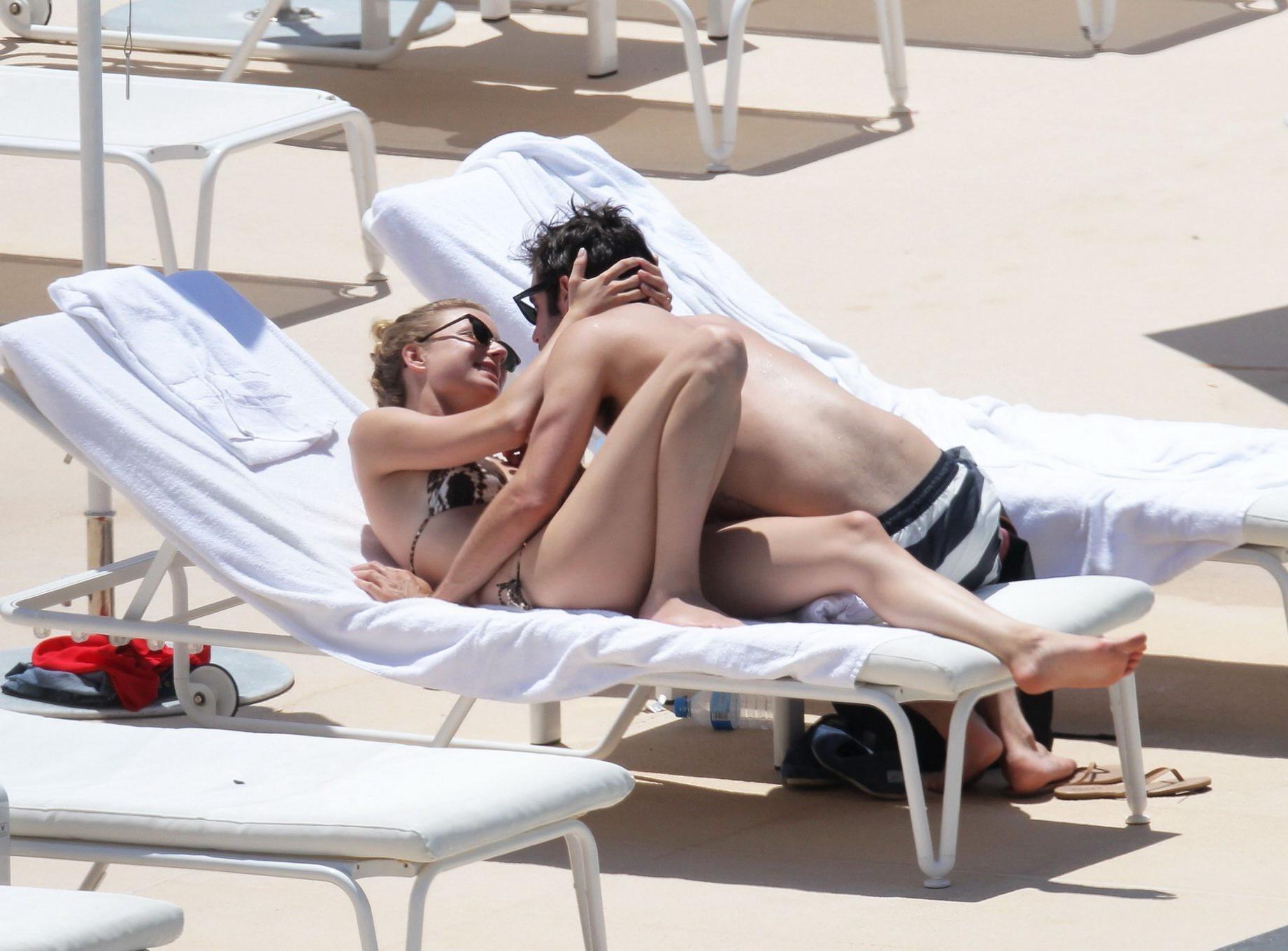 10P Emily VanCamp in snake print bikini petting with her boyfriend poolside in Monac