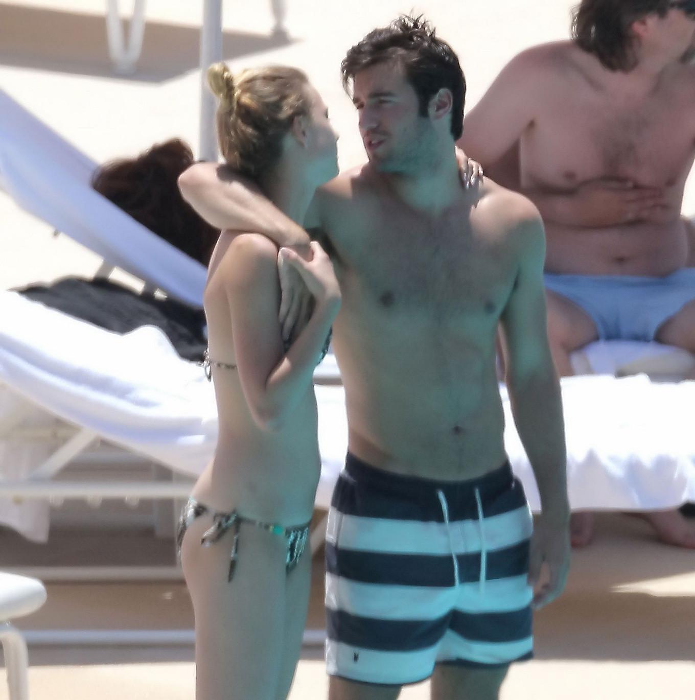 10P Emily VanCamp in snake print bikini petting with her boyfriend poolside in Monac