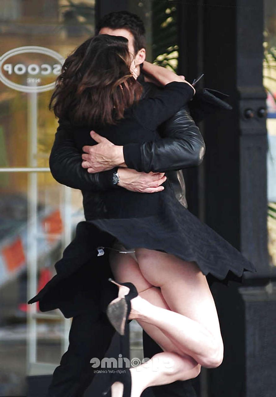 10P Milla Jovovich showing her ass in thong upskirt and topless in pool