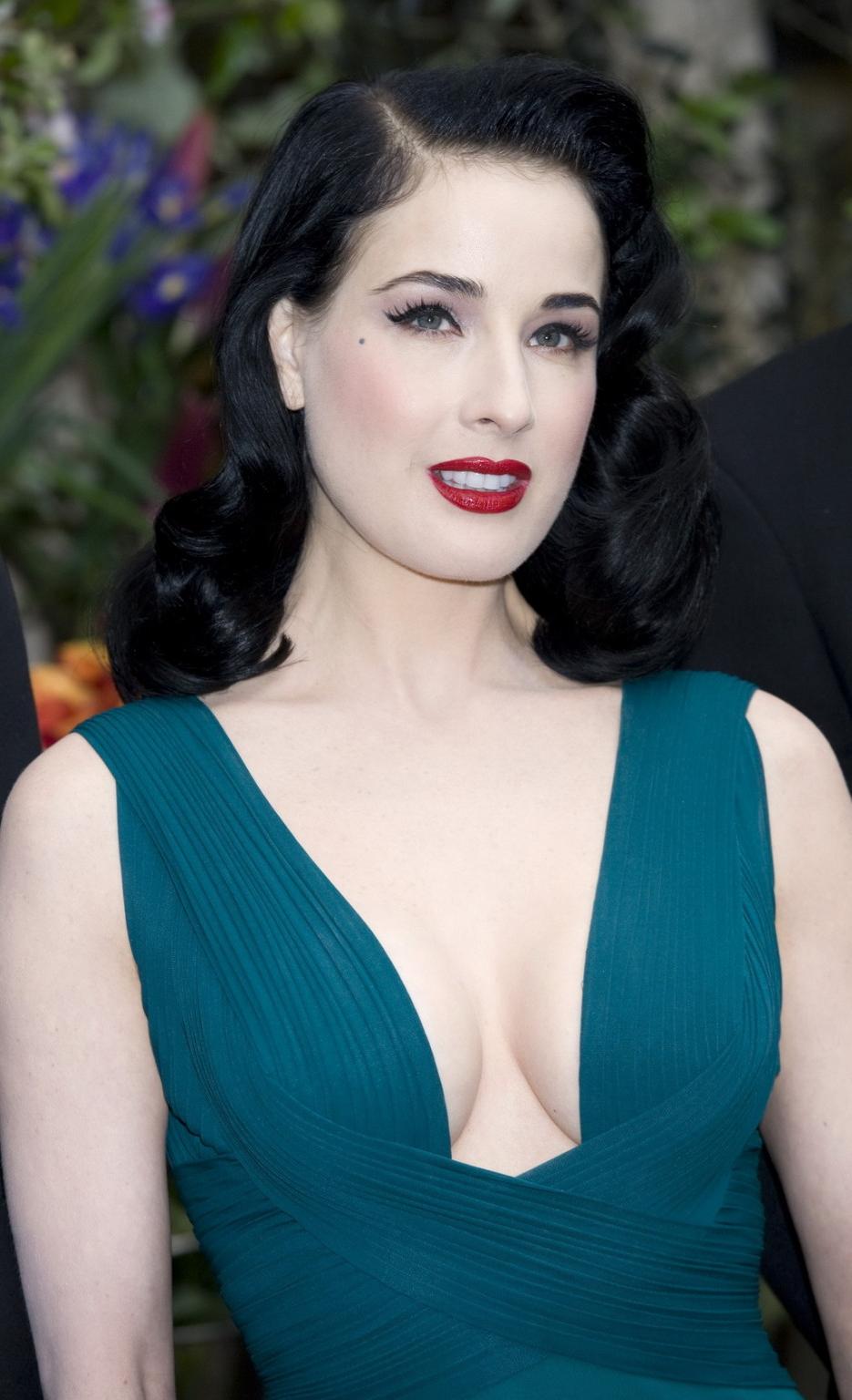 10P Dita Von Teese showing huge cleavage braless in hot dress while launching her de