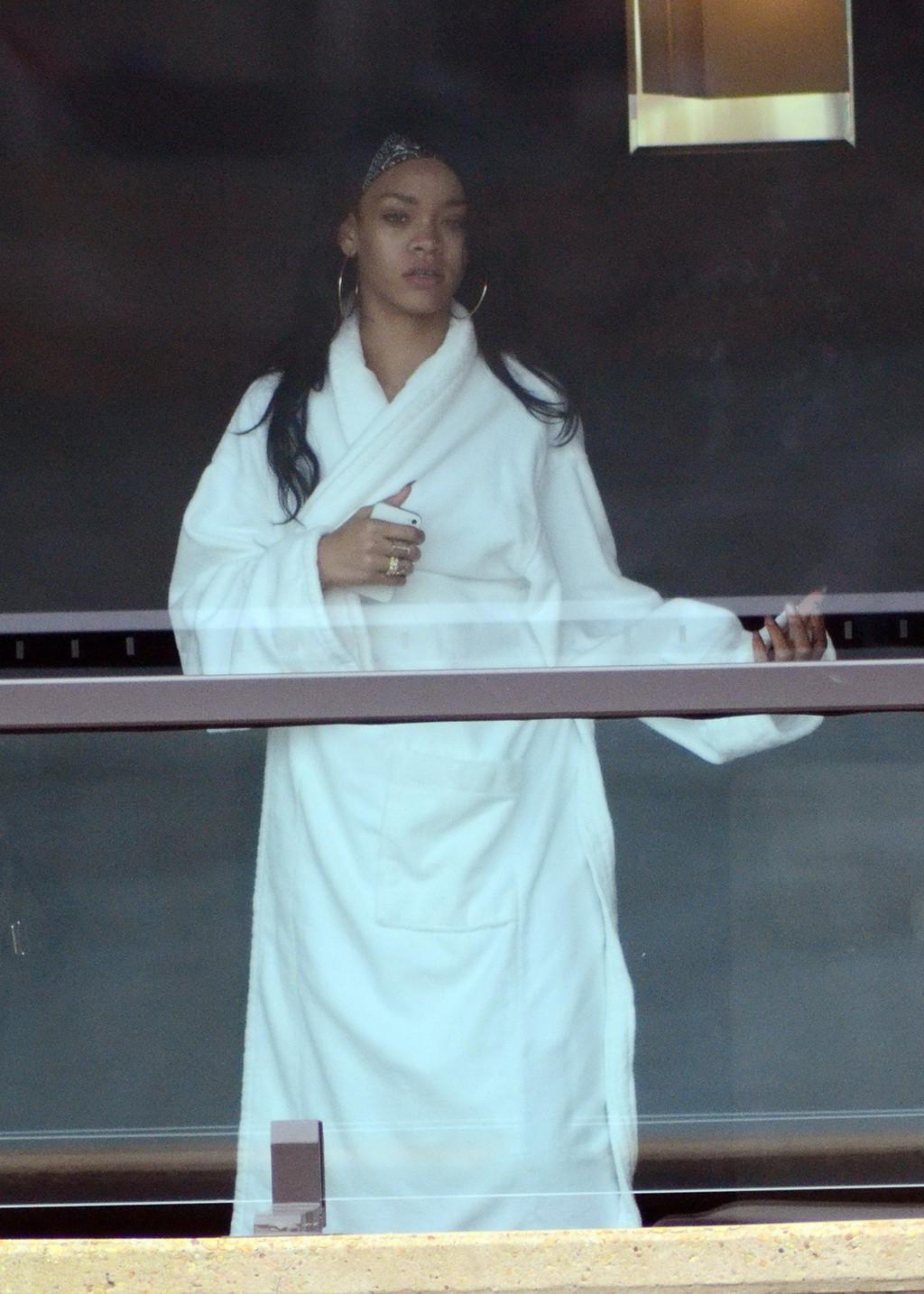 16P Rihanna showing big cleavage  long legs in wide open topcoat out in Sydney and a
