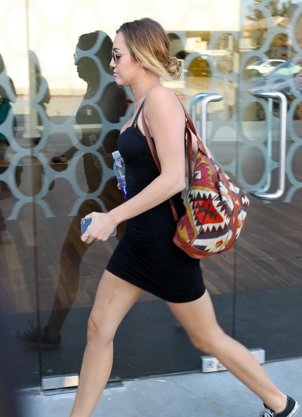 16P Miley Cyrus upskirt in a skimpy dress wearing no panties while leaving a pilates