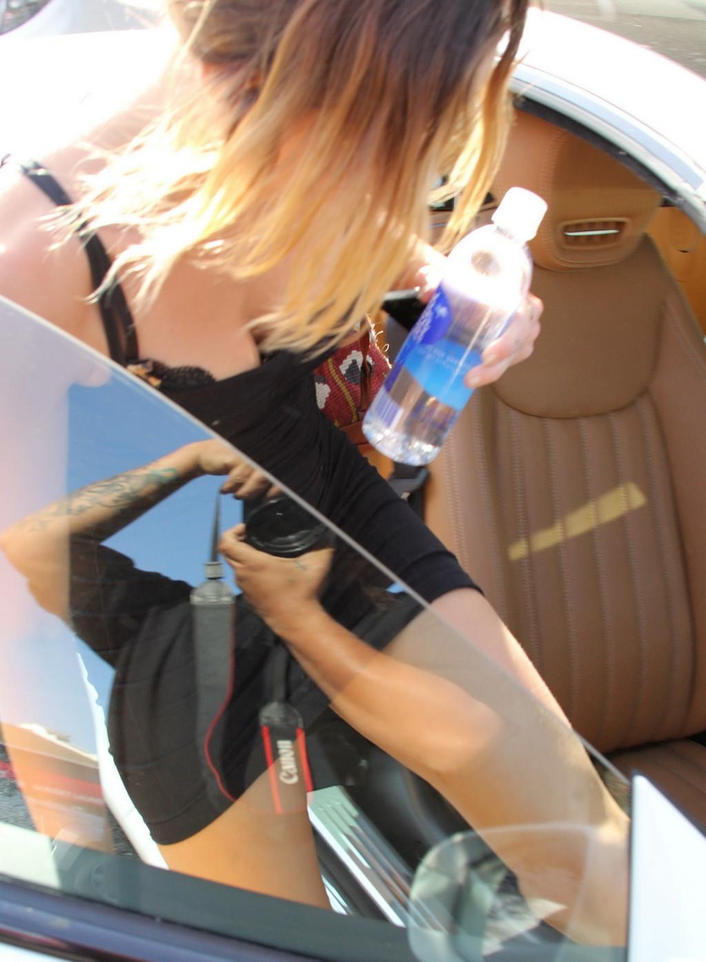 16P Miley Cyrus upskirt in a skimpy dress wearing no panties while leaving a pilates
