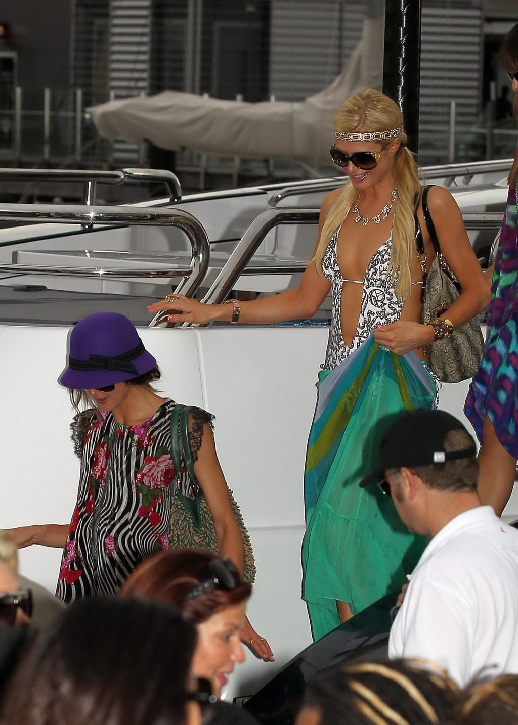 16P Paris Hilton showing her hot ass in deep cut swimsuit at the yacht in Sydney Har