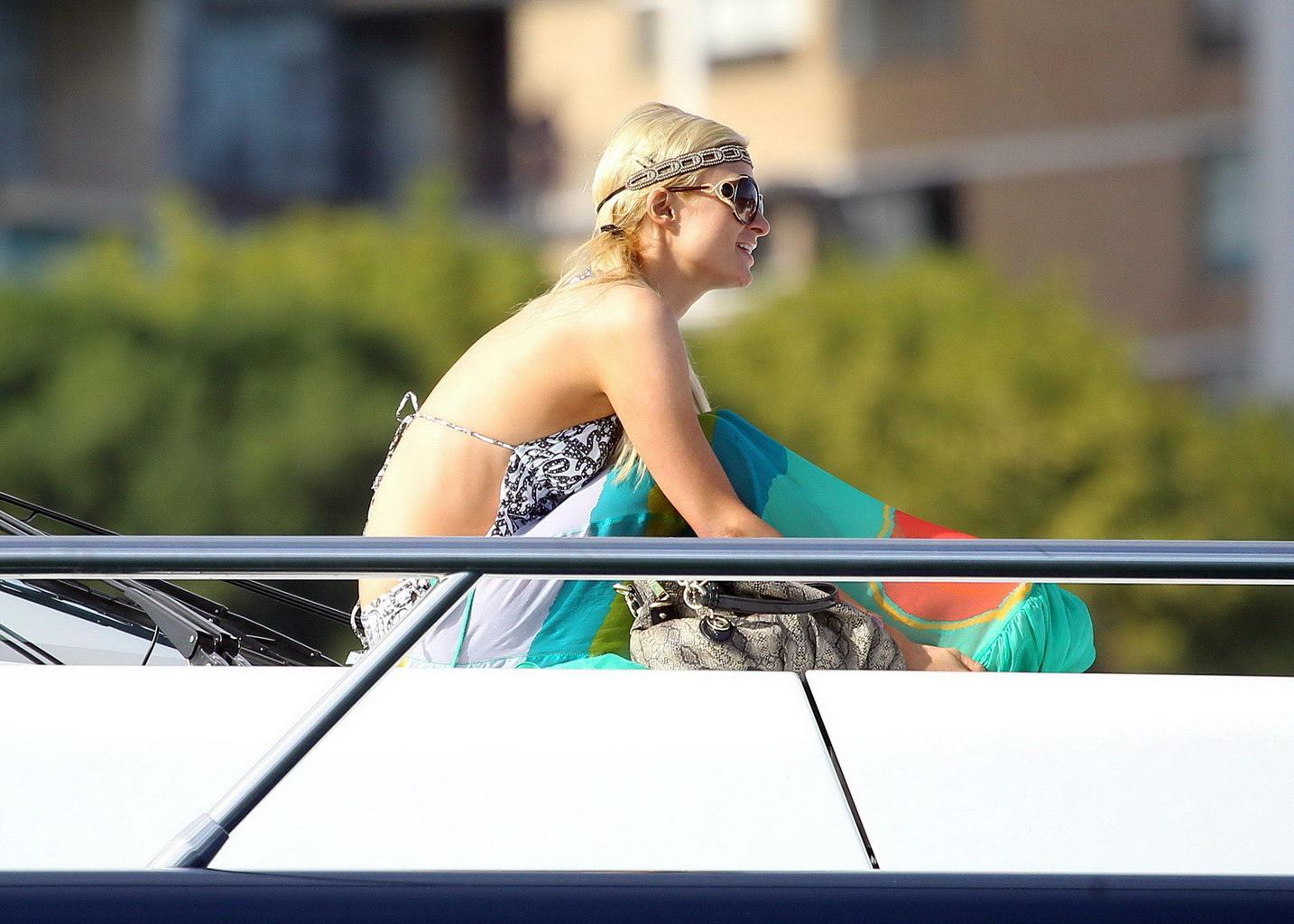 16P Paris Hilton showing her hot ass in deep cut swimsuit at the yacht in Sydney Har